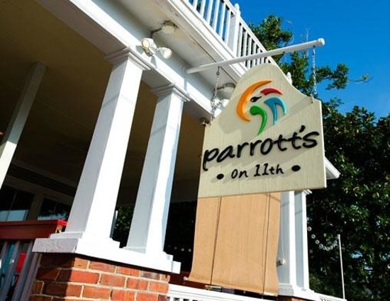 Parrott's on 11th restaurant sign with colorful parrot logo on a classic white column porch in Atlantic Beach NC