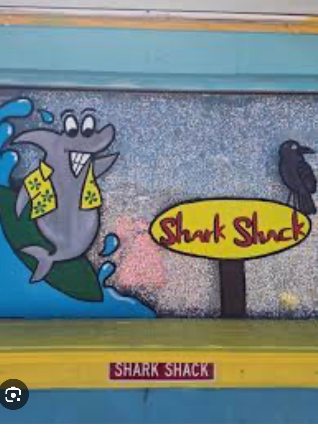 Shark Shack restaurant sign with cartoon shark mural Atlantic Beach NC